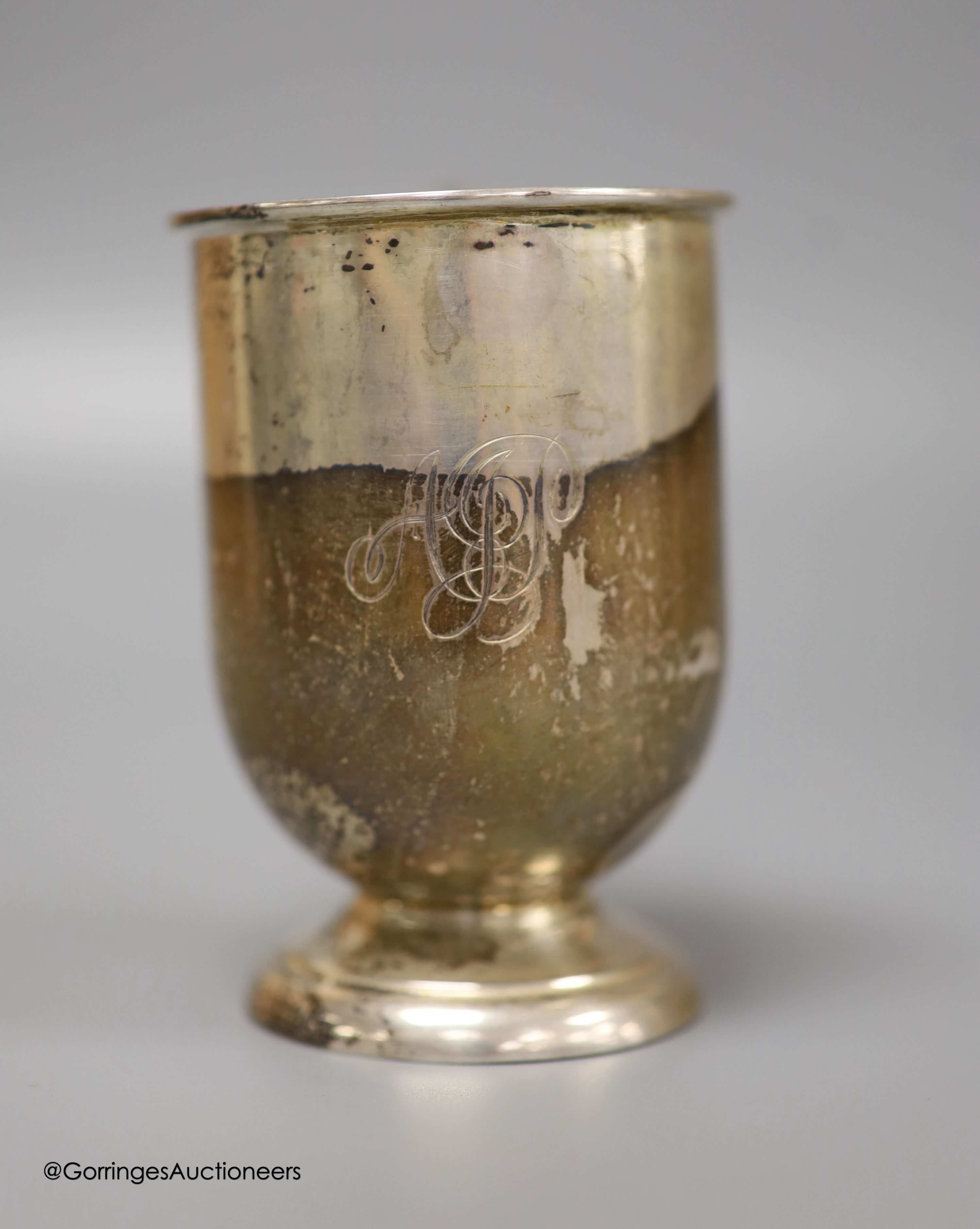 A Victorian silver cream boat, a small silver pedestal helmet cream jug and a silver Christening mug, gross 8.7oz